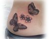 Butterfly tattoo design on abdomen